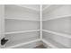 Bright pantry features all-white paint and well-organized shelving at 23162 E Canary Way, Queen Creek, AZ 85142