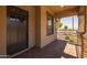 Inviting front porch with brick accents and wrought iron railing, perfect for relaxing at 23162 E Canary Way, Queen Creek, AZ 85142