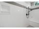 Close-up of a clean, bright shower featuring a built-in niche, handheld shower head, and a bench seat at 23162 E Canary Way, Queen Creek, AZ 85142
