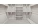 Spacious walk-in closet with ample shelving and hanging space, perfect for organized storage at 23162 E Canary Way, Queen Creek, AZ 85142