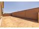 The backyard features a block fence surrounding the property for privacy at 23163 E Canary Way, Queen Creek, AZ 85142