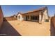 Spacious backyard featuring a covered patio and block wall surround for added privacy at 23163 E Canary Way, Queen Creek, AZ 85142
