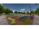 Well-maintained basketball court surrounded by lush landscaping and walking trails, providing recreational space at 23163 E Canary Way, Queen Creek, AZ 85142