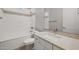 Clean bathroom with a shower-tub combo, granite countertop, and modern fixtures at 23163 E Canary Way, Queen Creek, AZ 85142