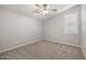 Neutral bedroom featuring a window and ceiling fan at 23163 E Canary Way, Queen Creek, AZ 85142