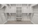 Walk-in closet with ample shelving and rods providing plenty of storage space at 23163 E Canary Way, Queen Creek, AZ 85142