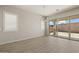 Bright dining area features sliding glass doors and modern light fixture with backyard access at 23163 E Canary Way, Queen Creek, AZ 85142