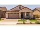 Charming home featuring a tile roof, and lush landscaping adding to its curb appeal at 23163 E Canary Way, Queen Creek, AZ 85142