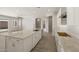 Open-concept kitchen features a large island with seating, granite counters, and flows into living area at 23163 E Canary Way, Queen Creek, AZ 85142