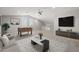 Neutral living room features a foosball table, ceiling fan, and modern finishes at 23163 E Canary Way, Queen Creek, AZ 85142