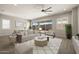 Staged living room with furniture, decor and large windows and slider door at 23163 E Canary Way, Queen Creek, AZ 85142