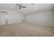 Spacious living room features neutral paint, recessed lighting, and ceiling fan at 23163 E Canary Way, Queen Creek, AZ 85142