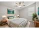 Bright main bedroom features a ceiling fan and neutral finishes at 23163 E Canary Way, Queen Creek, AZ 85142