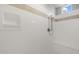 Shower stall featuring showerhead, bench, tile accents, and bright lighting at 23163 E Canary Way, Queen Creek, AZ 85142