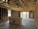 Open-concept living area with exposed framing highlighting the spacious layout and structural details of the home at 24083 W Bowker St, Buckeye, AZ 85326