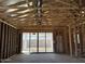 Framed sliding glass doors lead to the patio, showcasing the connection between indoor and outdoor living spaces at 24083 W Bowker St, Buckeye, AZ 85326