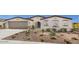 Charming single-story home featuring desert landscaping, a neutral color scheme, and a welcoming arched entryway at 2437 W Jessica Ln, Phoenix, AZ 85041