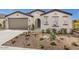 Charming single-story home featuring desert landscaping, a neutral color scheme, and a welcoming arched entryway at 2437 W Jessica Ln, Phoenix, AZ 85041