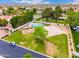 An aerial view shows community recreational area with pool, basketball and volleyball courts at 2505 E Lehi Rd # 16, Mesa, AZ 85213