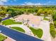 Stunning aerial view of the home showing lush landscaping, circular drive, and tile roof at 2505 E Lehi Rd # 16, Mesa, AZ 85213