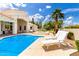 Spacious backyard featuring a pool, hot tub, lounge chairs, and manicured landscaping at 2505 E Lehi Rd # 16, Mesa, AZ 85213