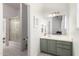 Bathroom with hexagon tile floors, a green vanity with a white countertop, and a large mirror at 2505 E Lehi Rd # 16, Mesa, AZ 85213