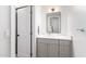 Bathroom featuring a gray vanity with white countertops, a mirror and white door at 2505 E Lehi Rd # 16, Mesa, AZ 85213