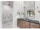 Modern bathroom with a marble shower, elegant vanity, and stylish fixtures, offering a clean and luxurious design at 2505 E Lehi Rd # 16, Mesa, AZ 85213