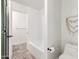 Bathroom featuring a tub, toilet and macrame wall decor at 2505 E Lehi Rd # 16, Mesa, AZ 85213