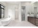 Luxurious bathroom with a freestanding tub, walk-in shower, and elegant vanity, designed for relaxation and comfort at 2505 E Lehi Rd # 16, Mesa, AZ 85213