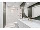 The bathroom features a walk in shower and a vanity with marble countertops and a round mirror at 2505 E Lehi Rd # 16, Mesa, AZ 85213