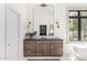Elegant bathroom with a wood vanity, dark countertop, and stylish mirror, combining functionality with sophisticated design at 2505 E Lehi Rd # 16, Mesa, AZ 85213