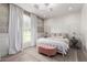 Bedroom with a canopy bed, decorative curtains, and a patterned rug at 2505 E Lehi Rd # 16, Mesa, AZ 85213