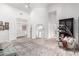 Spacious bedroom with light wood floors, a seating area, and a modern aesthetic, blending comfort and style at 2505 E Lehi Rd # 16, Mesa, AZ 85213