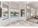 Breakfast nook with checkered flooring, pool view, and natural light from large windows at 2505 E Lehi Rd # 16, Mesa, AZ 85213