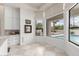 Bright breakfast nook offering backyard pool views and built-in storage cabinets at 2505 E Lehi Rd # 16, Mesa, AZ 85213