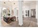 Spacious dining area featuring large windows, modern lighting, and neutral decor enhancing the open floor plan at 2505 E Lehi Rd # 16, Mesa, AZ 85213