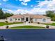 Stunning home featuring a tile roof, pristine landscaping, and a circular driveway at 2505 E Lehi Rd # 16, Mesa, AZ 85213