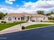 Beautiful home with a circular driveway, lush landscaping, and a well-maintained exterior at 2505 E Lehi Rd # 16, Mesa, AZ 85213