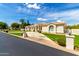 Elegant home with circular driveway, manicured lawn, and stucco exterior, offering curb appeal at 2505 E Lehi Rd # 16, Mesa, AZ 85213