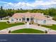 Attractive home with a circular drive, manicured lawn, and desert landscaping at 2505 E Lehi Rd # 16, Mesa, AZ 85213
