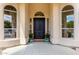 Charming front door entrance with decorative planters and stylish architectural details at 2505 E Lehi Rd # 16, Mesa, AZ 85213