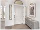 Elegant white front door with transom window and sidelights, showcasing stylish interior design at 2505 E Lehi Rd # 16, Mesa, AZ 85213