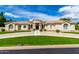 Elegant home with circular driveway, manicured lawn, and stucco exterior, offering curb appeal at 2505 E Lehi Rd # 16, Mesa, AZ 85213
