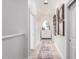 Hallway with hardwood floors, a round mirror, and framed artwork along the wall at 2505 E Lehi Rd # 16, Mesa, AZ 85213