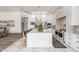 Modern kitchen with an expansive island, designer lighting, stainless steel appliances, and sleek cabinetry at 2505 E Lehi Rd # 16, Mesa, AZ 85213