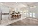 Open-concept kitchen featuring a large island with seating, stylish flooring, and an abundance of natural light at 2505 E Lehi Rd # 16, Mesa, AZ 85213