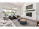 Comfortable living room with a fireplace, plush seating, and view of the backyard swimming pool at 2505 E Lehi Rd # 16, Mesa, AZ 85213