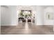 Bright living room with high ceilings, large windows, and stylish wood flooring at 2505 E Lehi Rd # 16, Mesa, AZ 85213