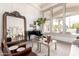 Elegant living room featuring a piano, modern furniture, large window with natural light, and hardwood floors at 2505 E Lehi Rd # 16, Mesa, AZ 85213